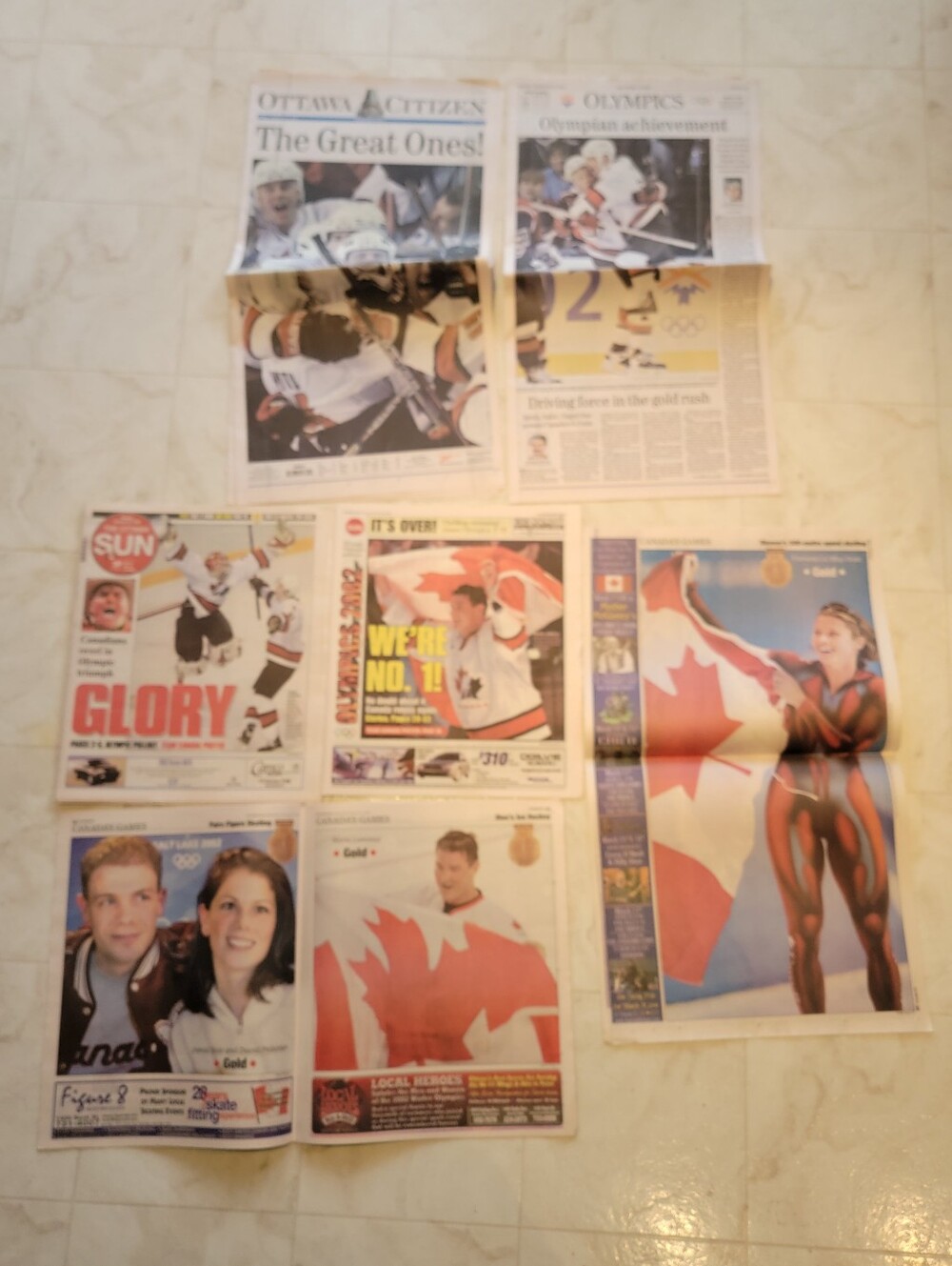 Two Newspapers Canada Olympics February 25 2002